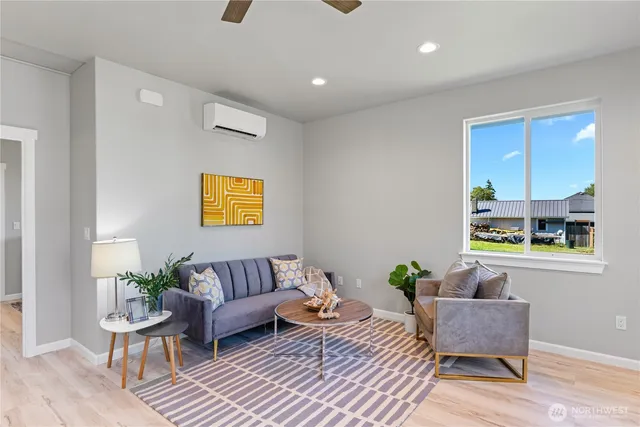 a living room with furniture and a potted plant