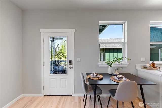 a view of a dining room with furniture and window