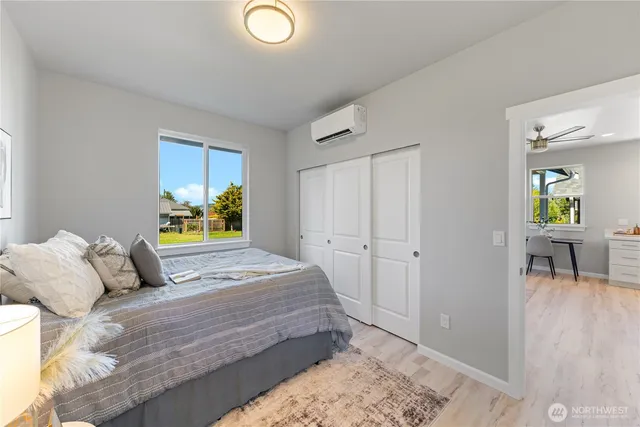 a bedroom with a bed and a dresser