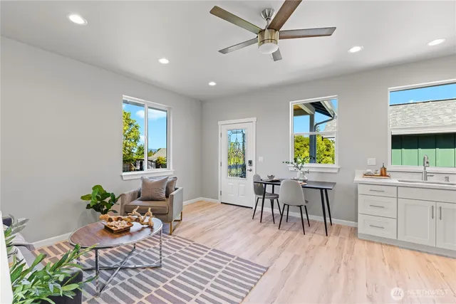 a view of a dining room with furniture window and wooden floor