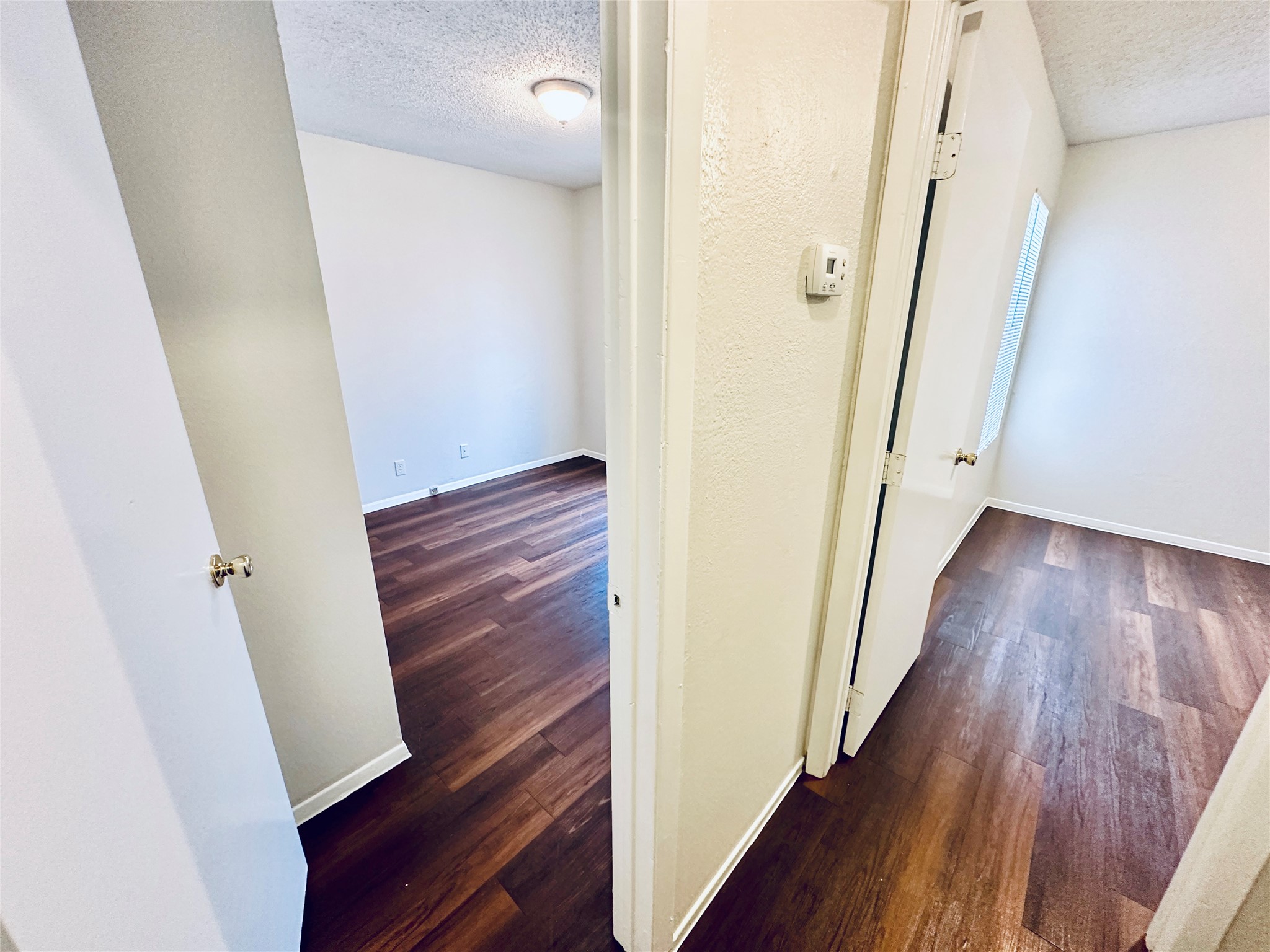 12505 Turtle Rock Road, Unit A Austin, TX 78729 - Photo 23 of 38 Lustrous hardwood flooring stretches through this well-maintained interior space.