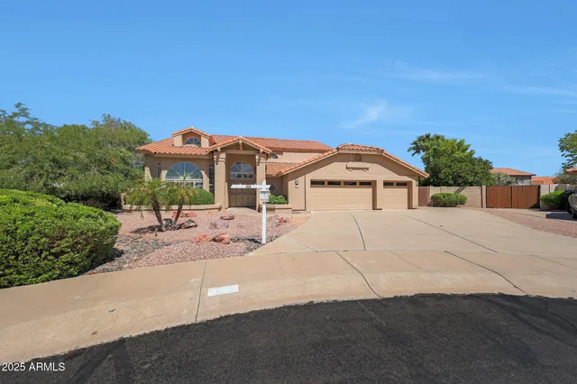 a view of a house with a street