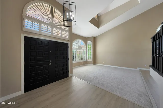 a view of a dining room with furniture and a window