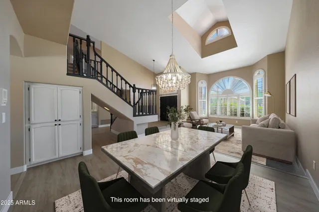 a kitchen with stainless steel appliances granite countertop a sink and refrigerator