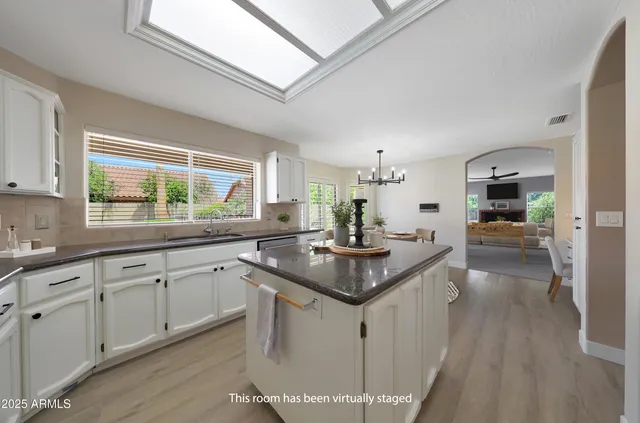 a living room with furniture a window and a fireplace