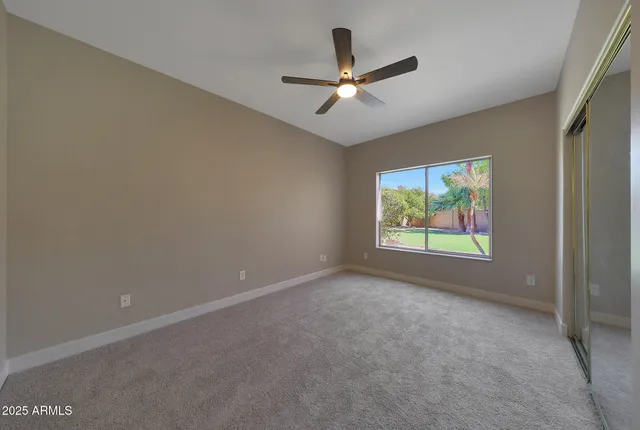 a spacious bedroom with a balcony a bed and a fireplace