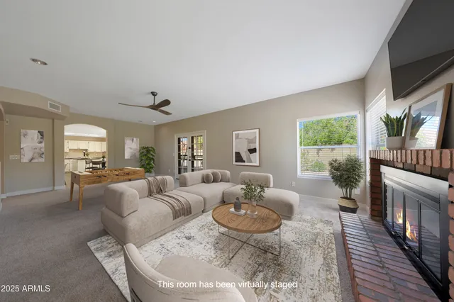 a living room with furniture fireplace and a flat screen tv