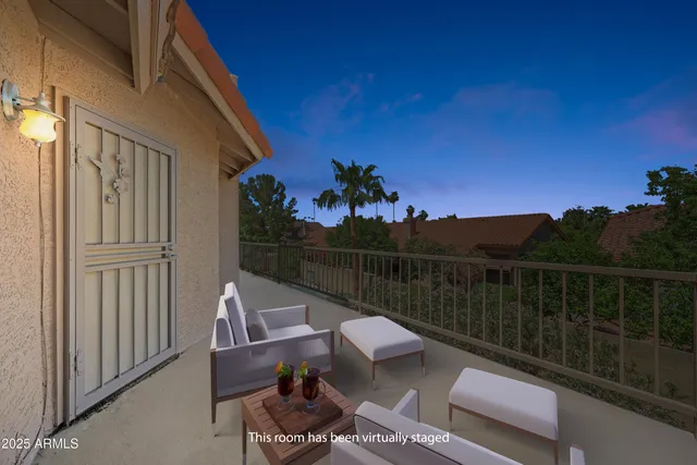 a view of a backyard with sitting area