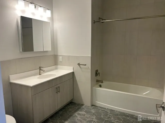 a bathroom with a sink and a bathtub