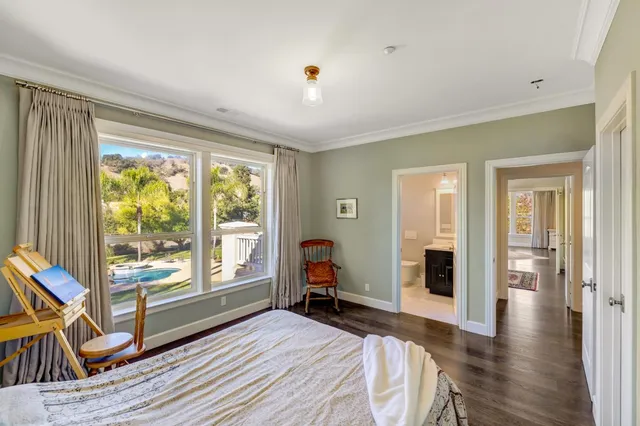 a bedroom with furniture and a window