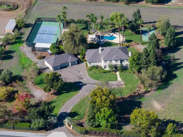 an aerial view of a house with a garden