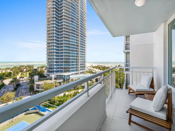 a view of balcony with furniture