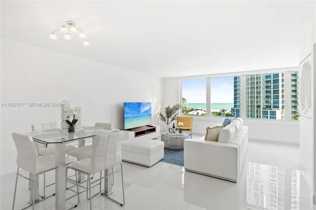 a living room with furniture and a large window
