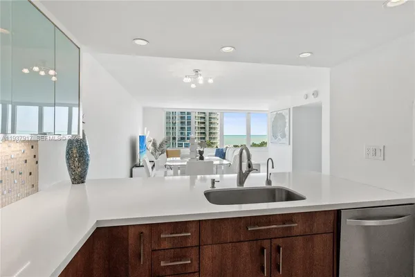 a kitchen with cabinets and window