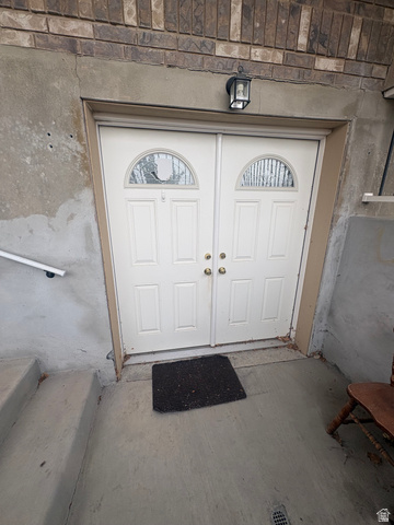3918 Mapleleaf Way West Jordan, UT 84088 - Photo 12 of 12 Doorway to property featuring stucco siding