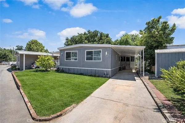 a front view of a house with a small yard