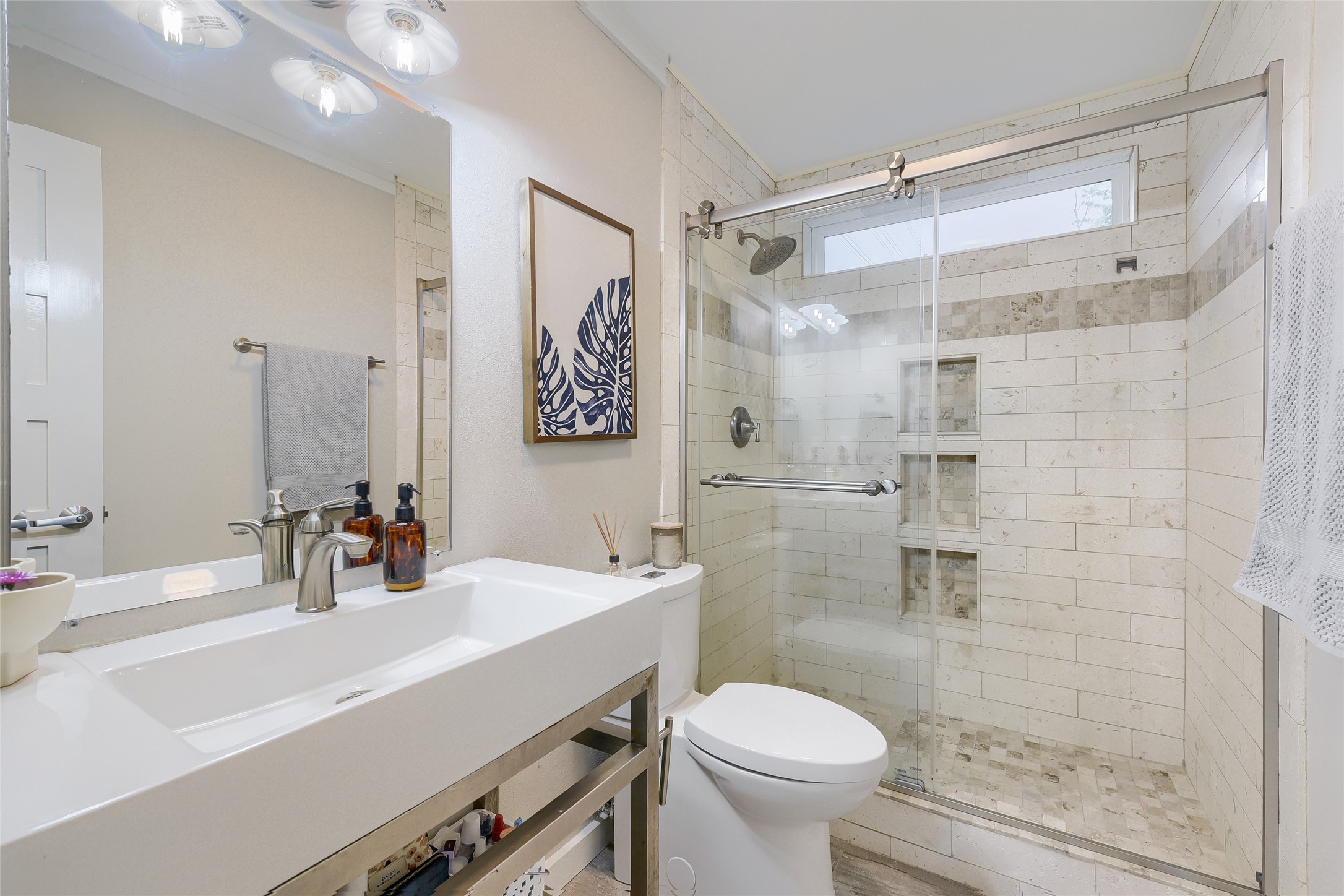 5707 Tracy Lynn Lane, Unit A Austin, TX 78721 - Photo 23 of 33 Bathroom featuring toilet and a shower stall