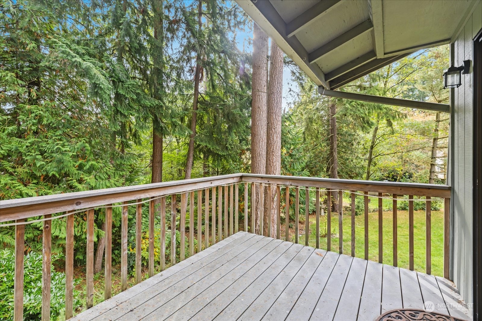 7023 Lower Ridge Road Everett, WA 98203 - Photo 34 of 38 a balcony with wooden floor and outdoor space