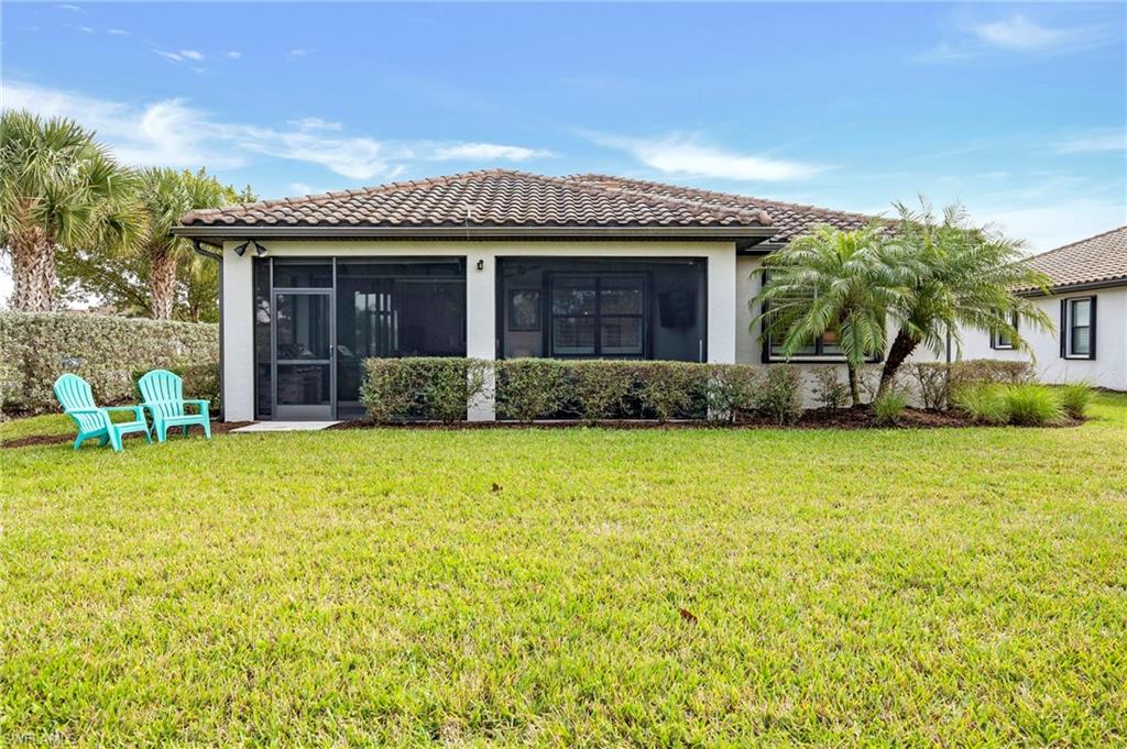 19802 Bittersweet Lane Estero, FL 33928 - Photo 18 of 50 a front view of a house with garden