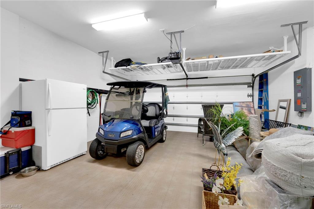 19802 Bittersweet Lane Estero, FL 33928 - Photo 35 of 50 a car parked in a garage