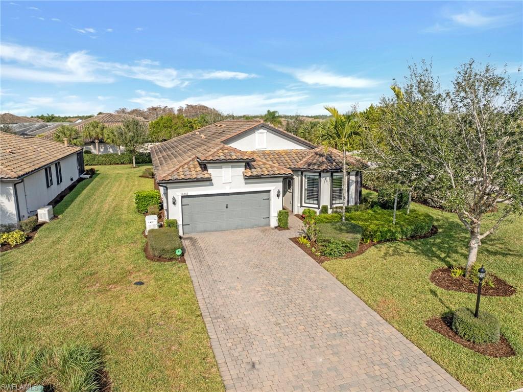 19802 Bittersweet Lane Estero, FL 33928 - Photo 37 of 50 a aerial view of a house with a yard