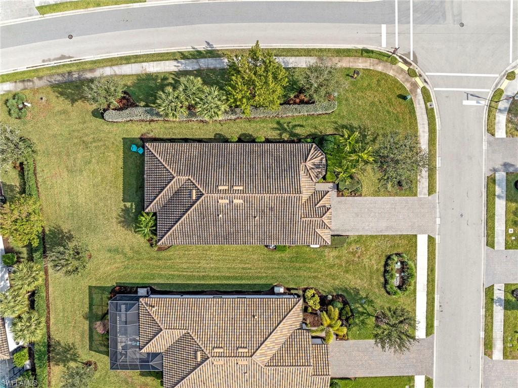 19802 Bittersweet Lane Estero, FL 33928 - Photo 40 of 50 an aerial view of a residential houses with yard
