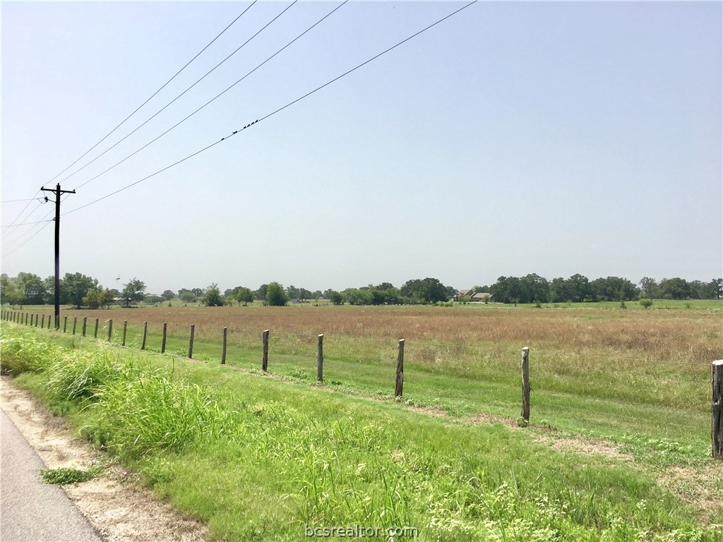 7034 Shirley Road Bryan, TX 77808 - Photo 1 of 1 a view of a lake with a big yard and a large mountain view