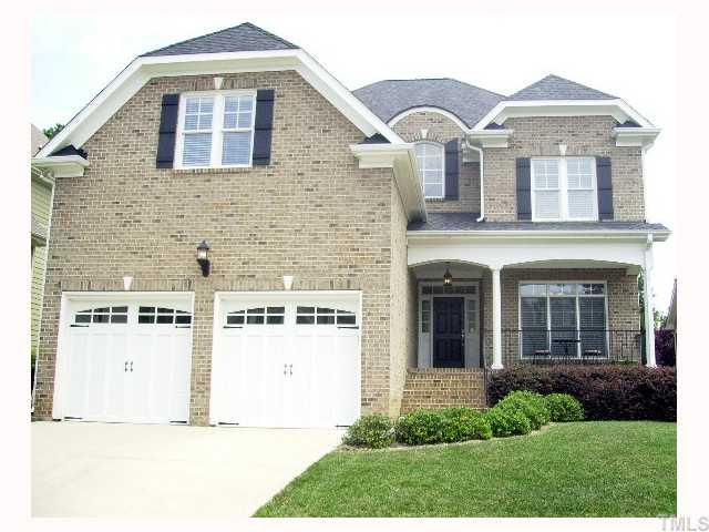 12240 Beestone Lane Raleigh, NC 27614 - Photo 1 of 12 a front view of a house with a yard