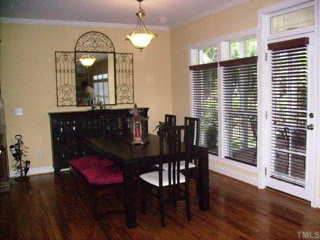 12240 Beestone Lane Raleigh, NC 27614 - Photo 4 of 12 a view of a dining room with furniture window and wooden floor