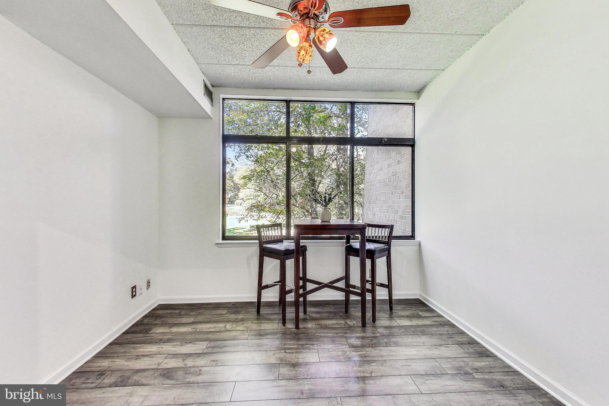 2120 Green Watch Way, Unit 201 Reston, VA 20191 - Photo 8 of 51 Dining Area with Wall of Windows