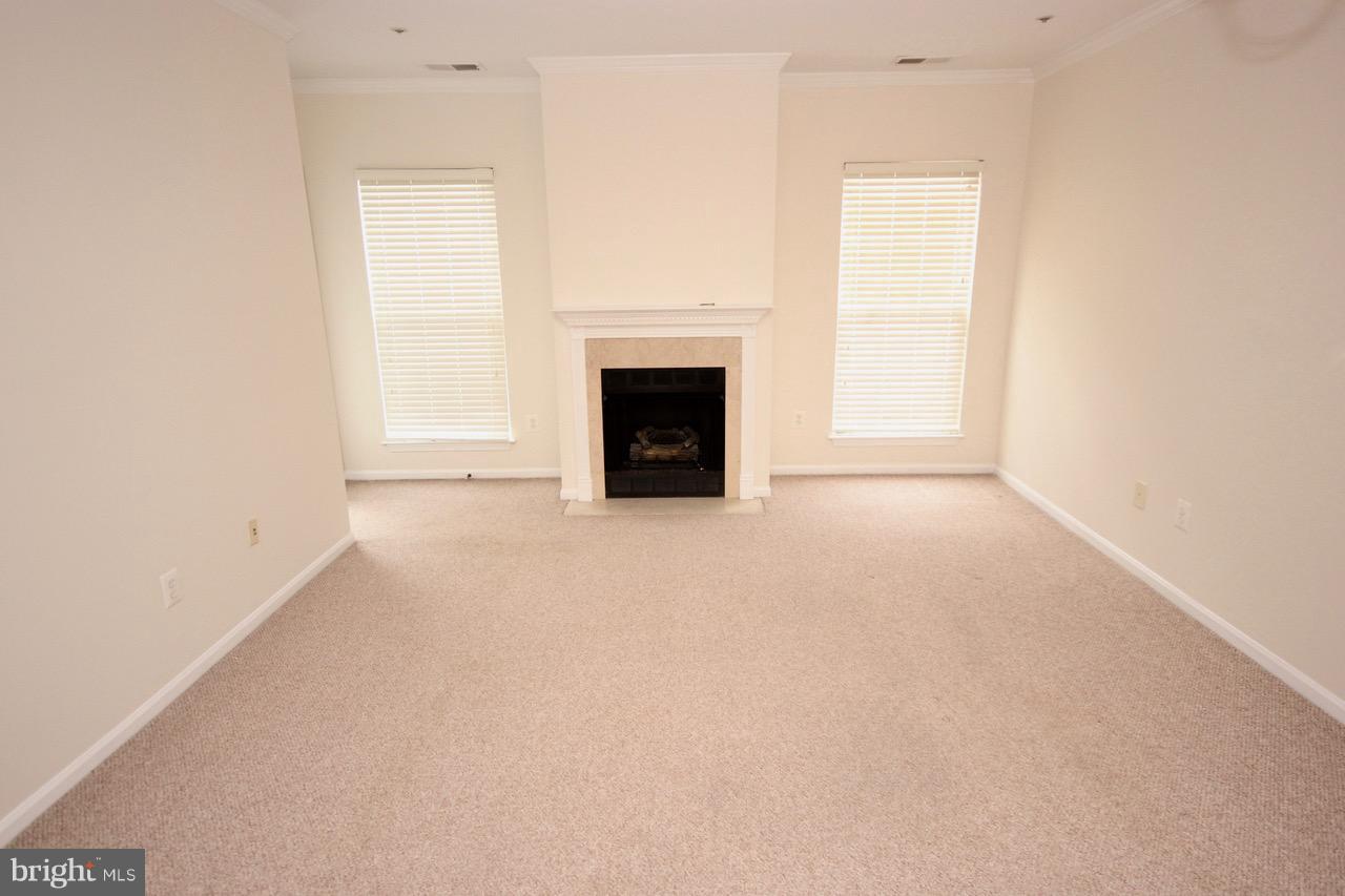 7000 Falls Reach Drive, Unit 110 Falls Church, VA 22043 - Photo 14 of 26 a view of empty room with a fireplace