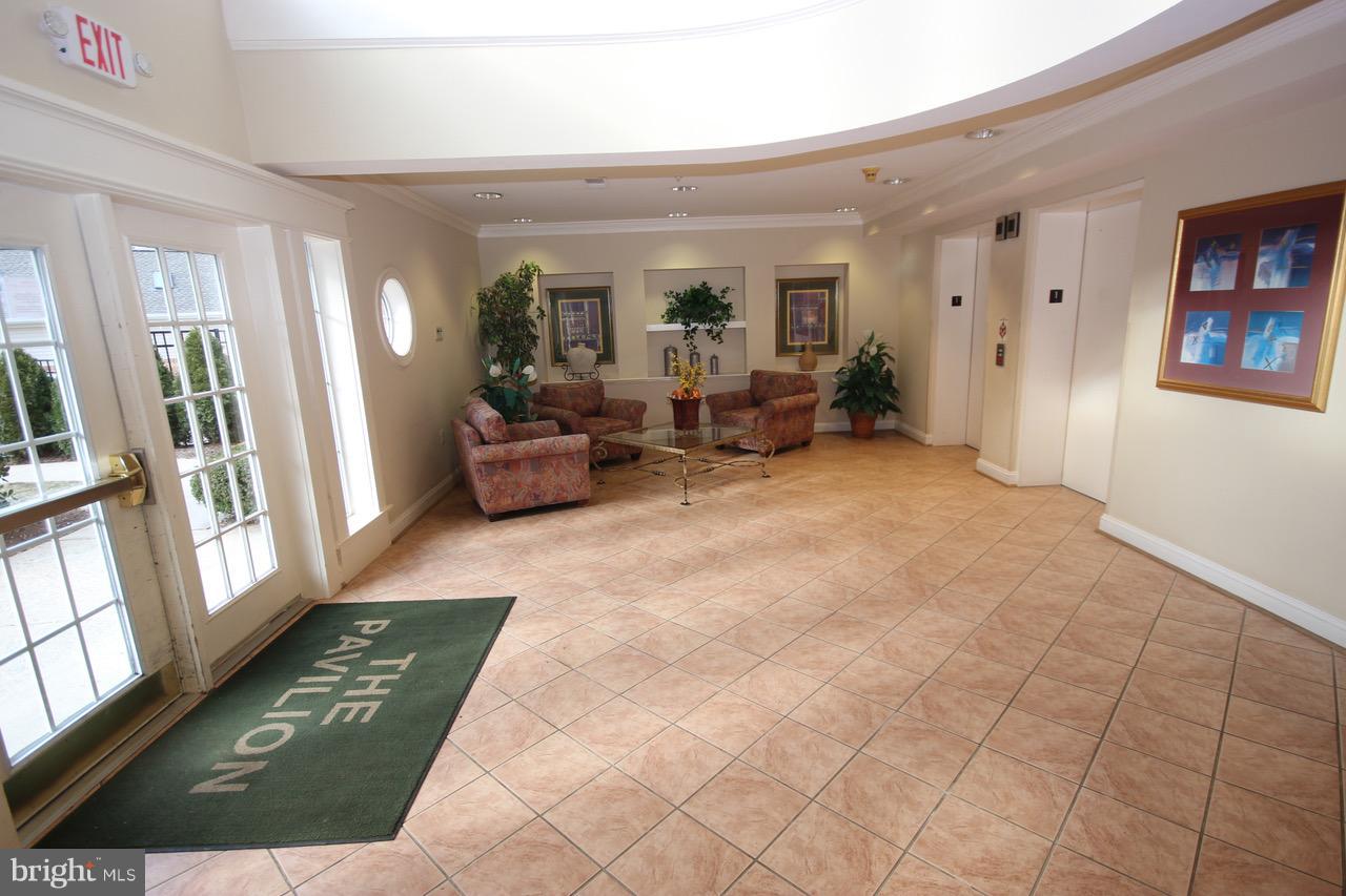 7000 Falls Reach Drive, Unit 110 Falls Church, VA 22043 - Photo 17 of 26 a view of a living room and a couch