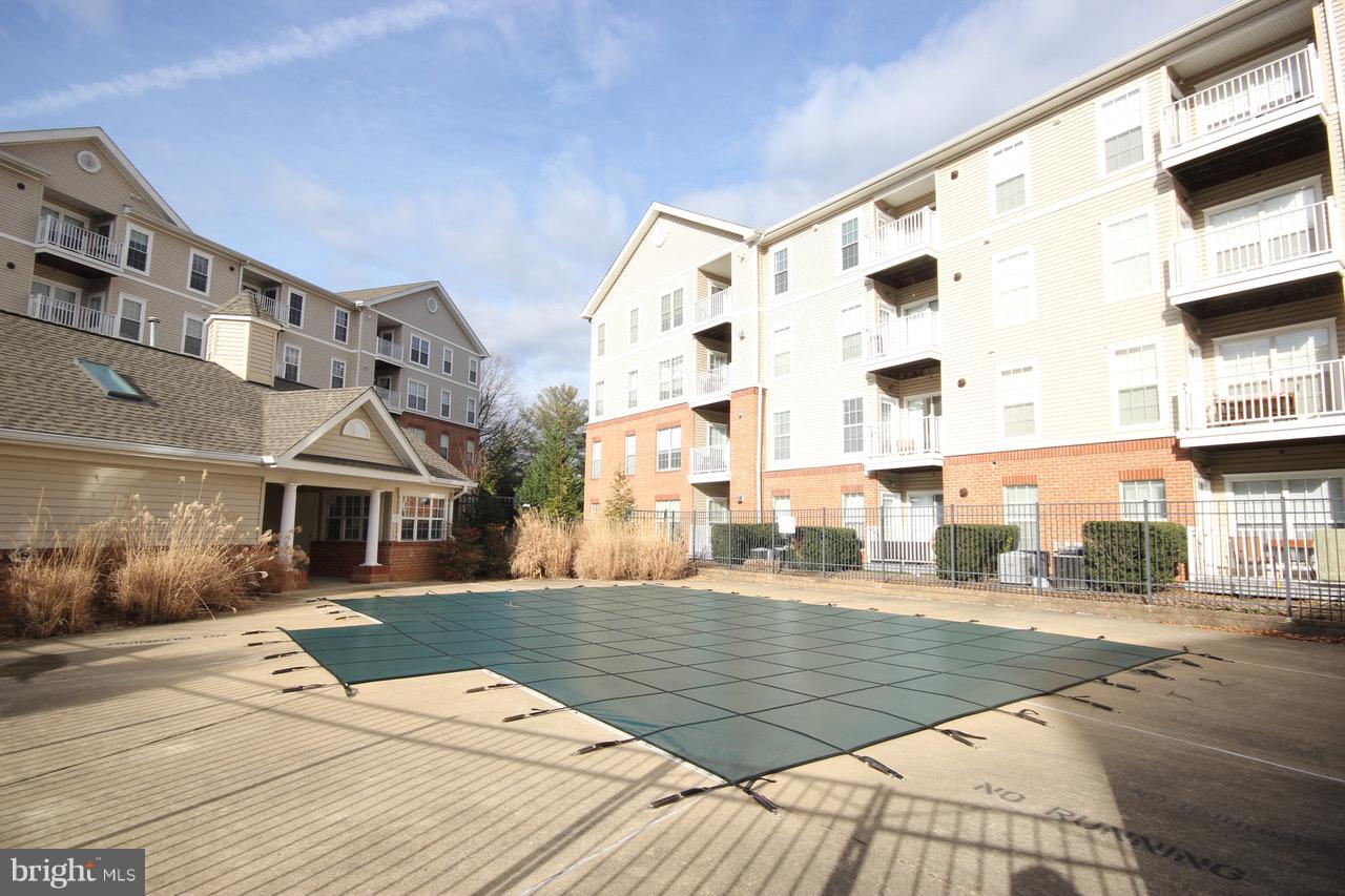 7000 Falls Reach Drive, Unit 110 Falls Church, VA 22043 - Photo 19 of 26 a view of a building with many windows