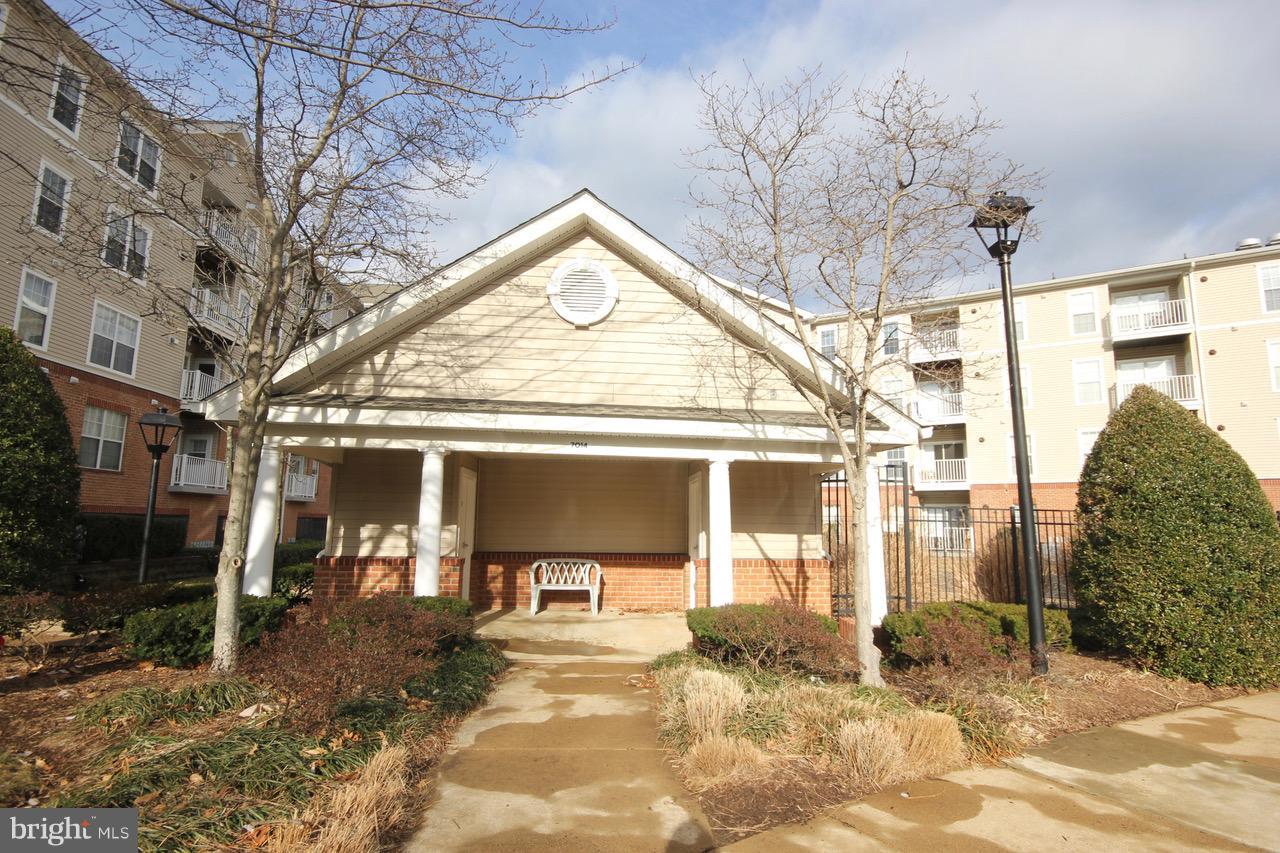 7000 Falls Reach Drive, Unit 110 Falls Church, VA 22043 - Photo 20 of 26 a view of a building with a outdoor space