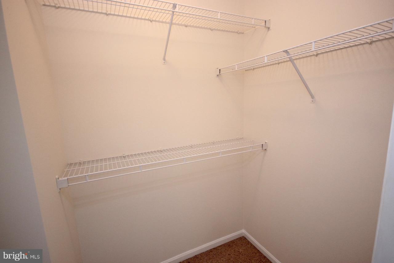 7000 Falls Reach Drive, Unit 110 Falls Church, VA 22043 - Photo 23 of 26 a view of a room with racks on the wall