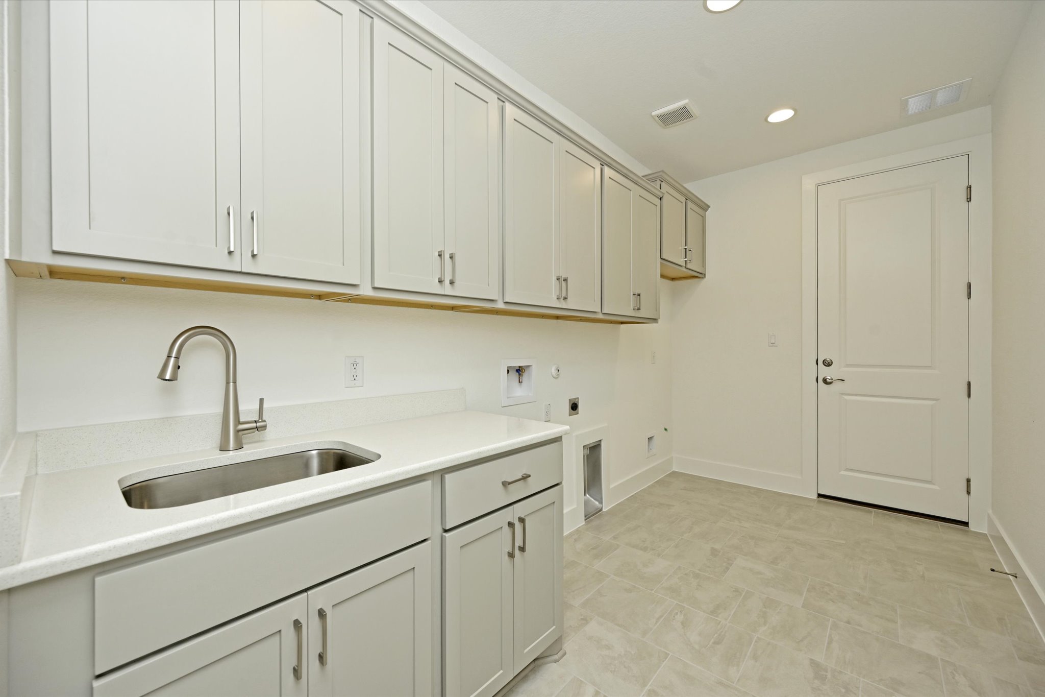 209 Scofield Avenue Georgetown, TX 78626 - Photo 14 of 33 a kitchen with white cabinets and a sink
