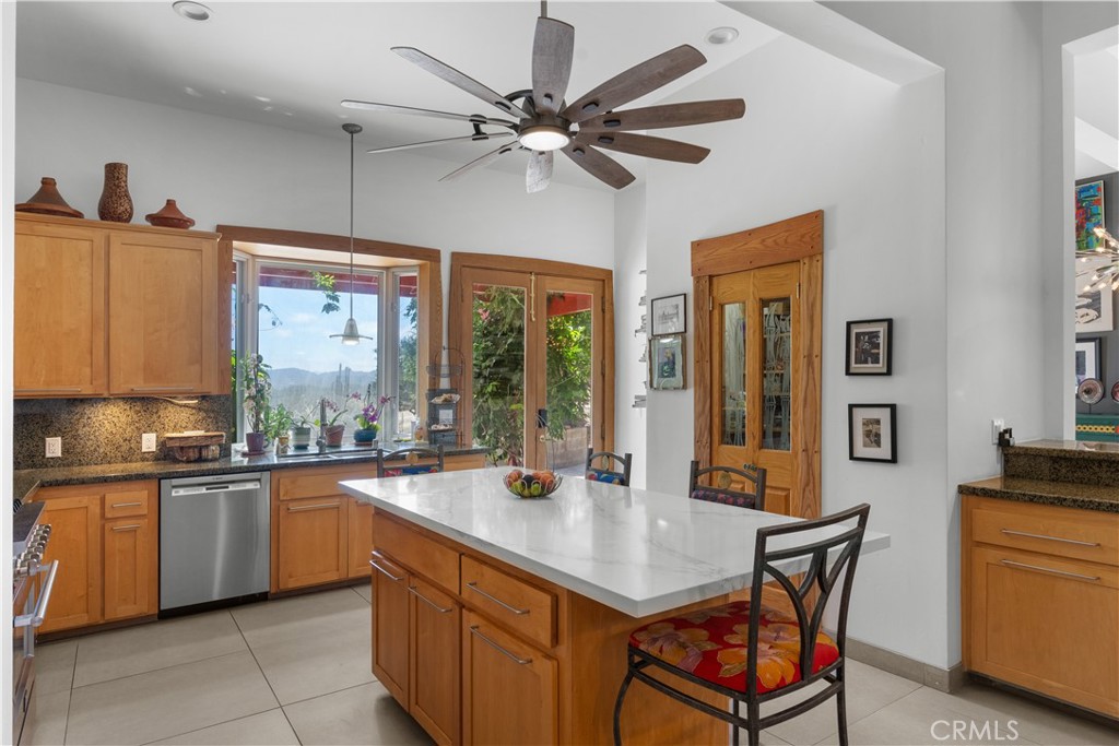 1012 Upper Los Berros Road Nipomo, CA 93444 - Photo 12 of 75 a kitchen with a sink refrigerator and cabinets