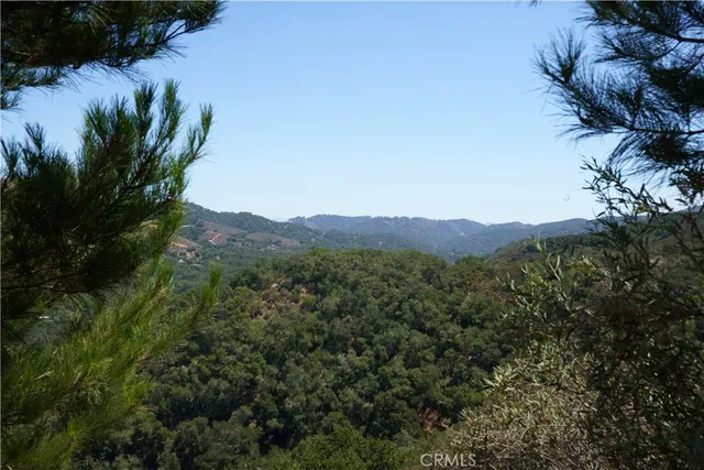 a living room with furniture gym equipment and a large window