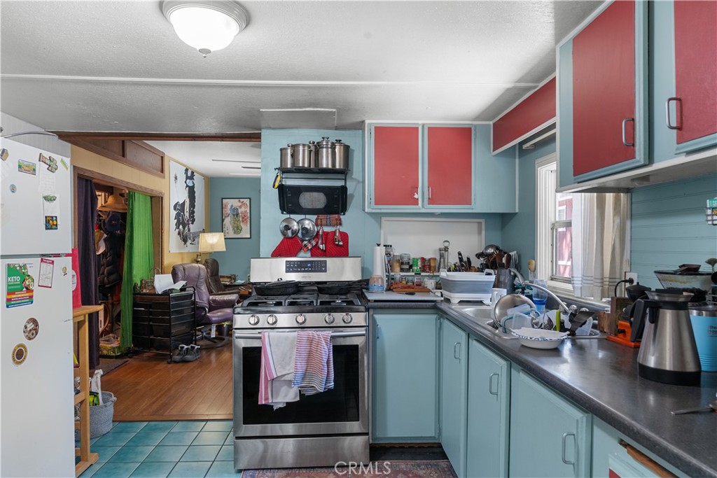 1012 Upper Los Berros Road Nipomo, CA 93444 - Photo 61 of 75 a kitchen with stainless steel appliances granite countertop a stove and cabinets