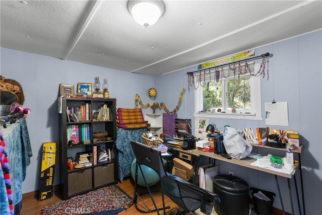 1012 Upper Los Berros Road Nipomo, CA 93444 - Photo 62 of 75 a work room with furniture a bookshelf and a window