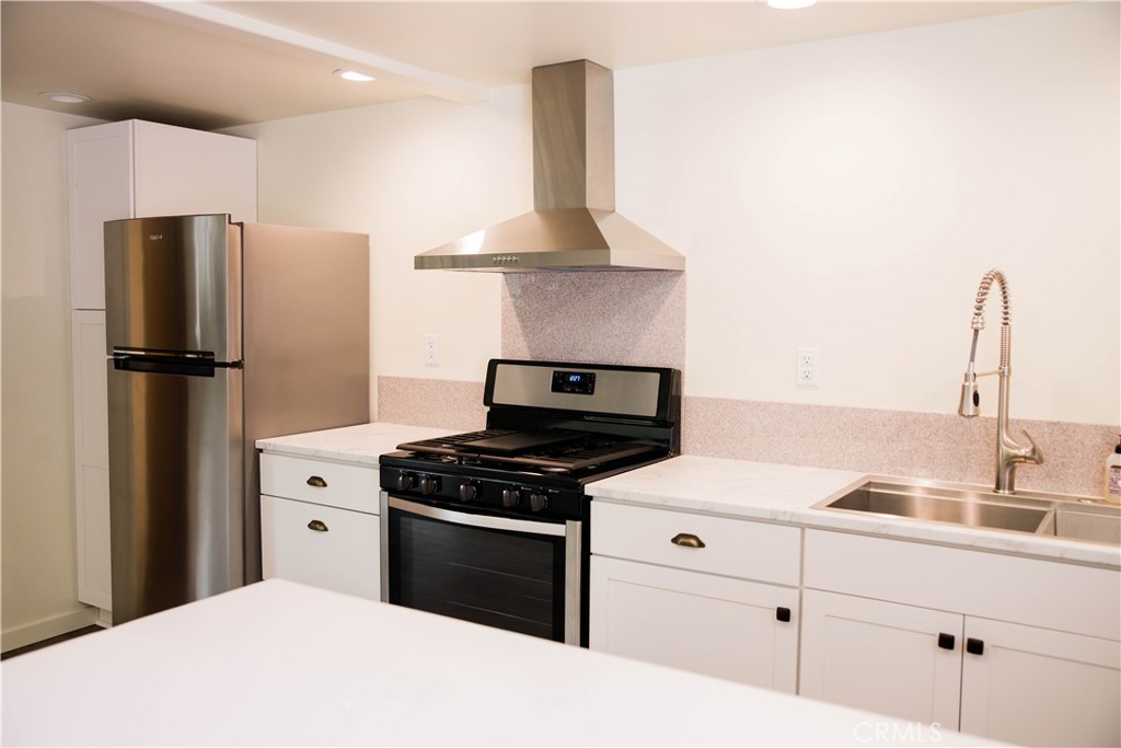 1012 Upper Los Berros Road Nipomo, CA 93444 - Photo 71 of 75 a kitchen with stainless steel appliances a refrigerator stove and sink