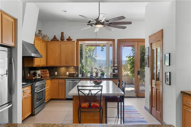 a kitchen with a sink refrigerator and cabinets