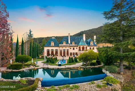 a view of swimming pool and outdoor seating