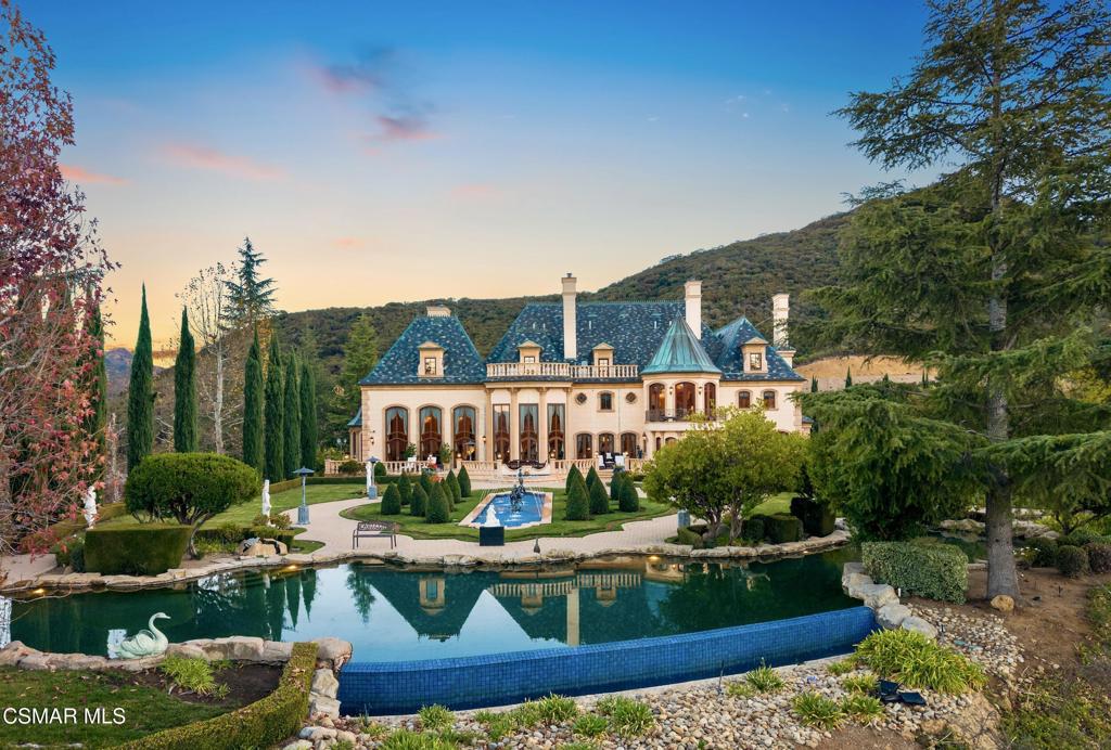 a view of swimming pool and outdoor seating