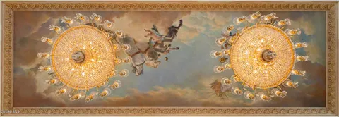 a living room with a fireplace and flowers