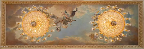 a living room with a fireplace and flowers