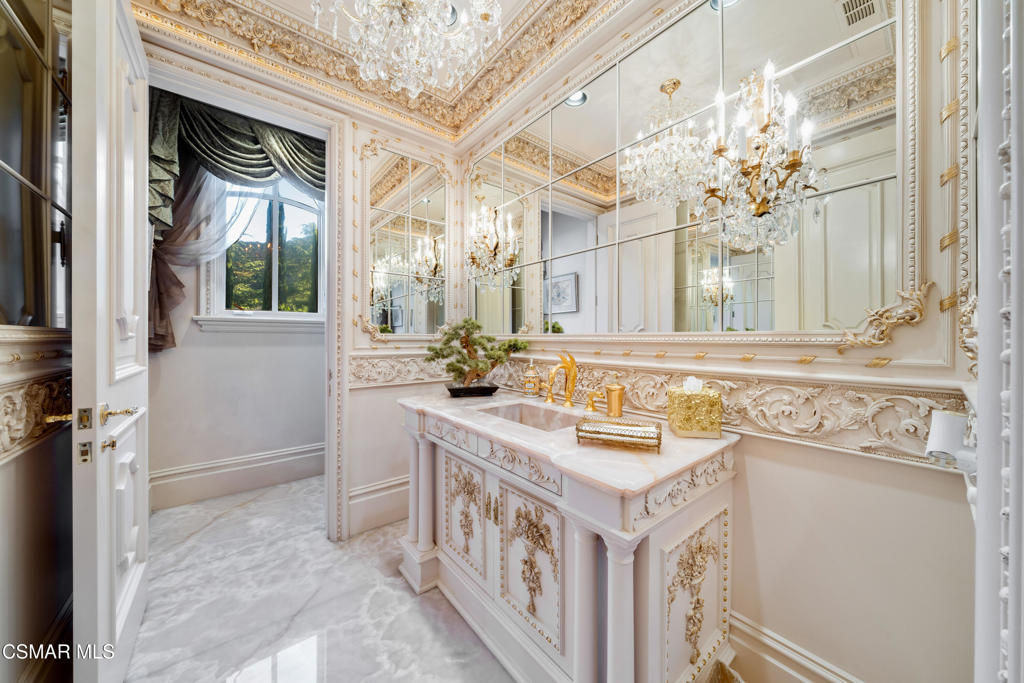 900 West Stafford Road Thousand Oaks, CA 91361 - Photo 35 of 79 a bathroom with a sink a vanity a mirror and a bathtub