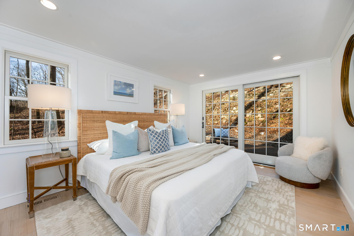 124 Wolfpit Road Wilton, CT 06897 - Photo 9 of 27 Primary bedroom with sliders to expansive deck with tons of privacy