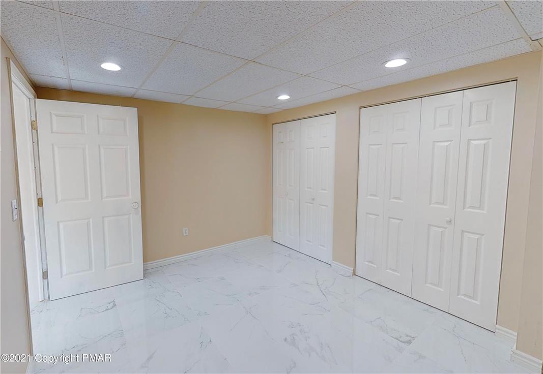 1110 Misty Ridge East Stroudsburg, PA 18302 - Photo 40 of 43 Functional bedroom with two sets of bifold closet doors and recessed lighting.