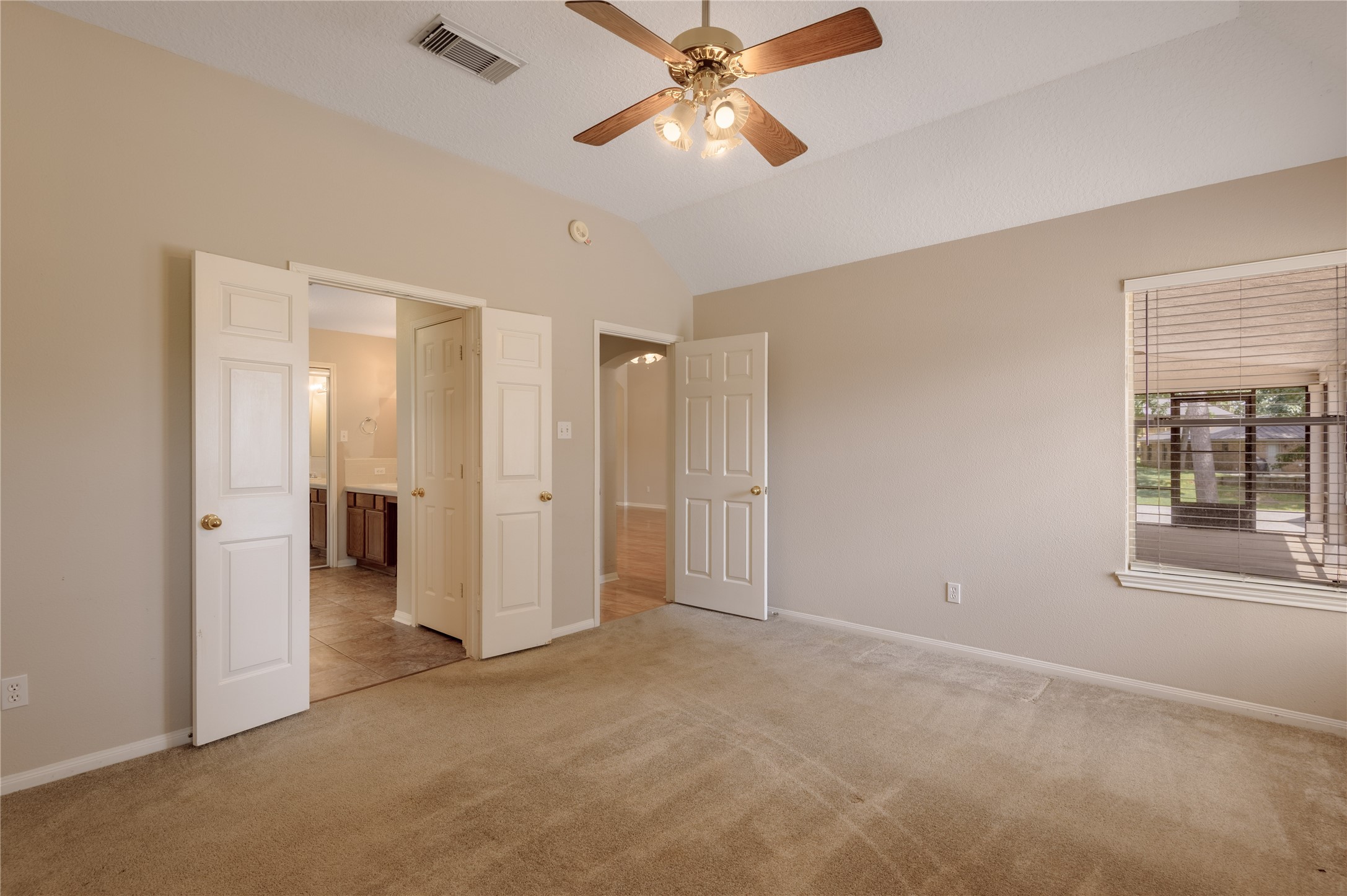 324 Red Oak Lane Trinity, TX 75862 - Photo 25 of 49 an empty room with closet and a chandelier fan